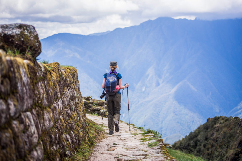 Tourist on his way to Machu Picchu along the Inca Trail